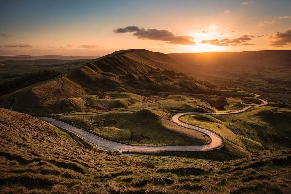 Sunset over mountains and road