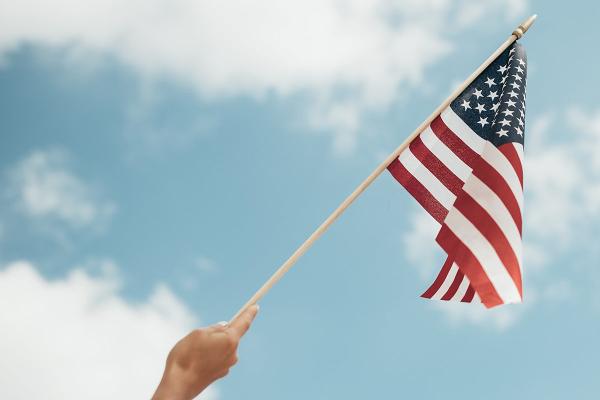 flag, blue sky, hand