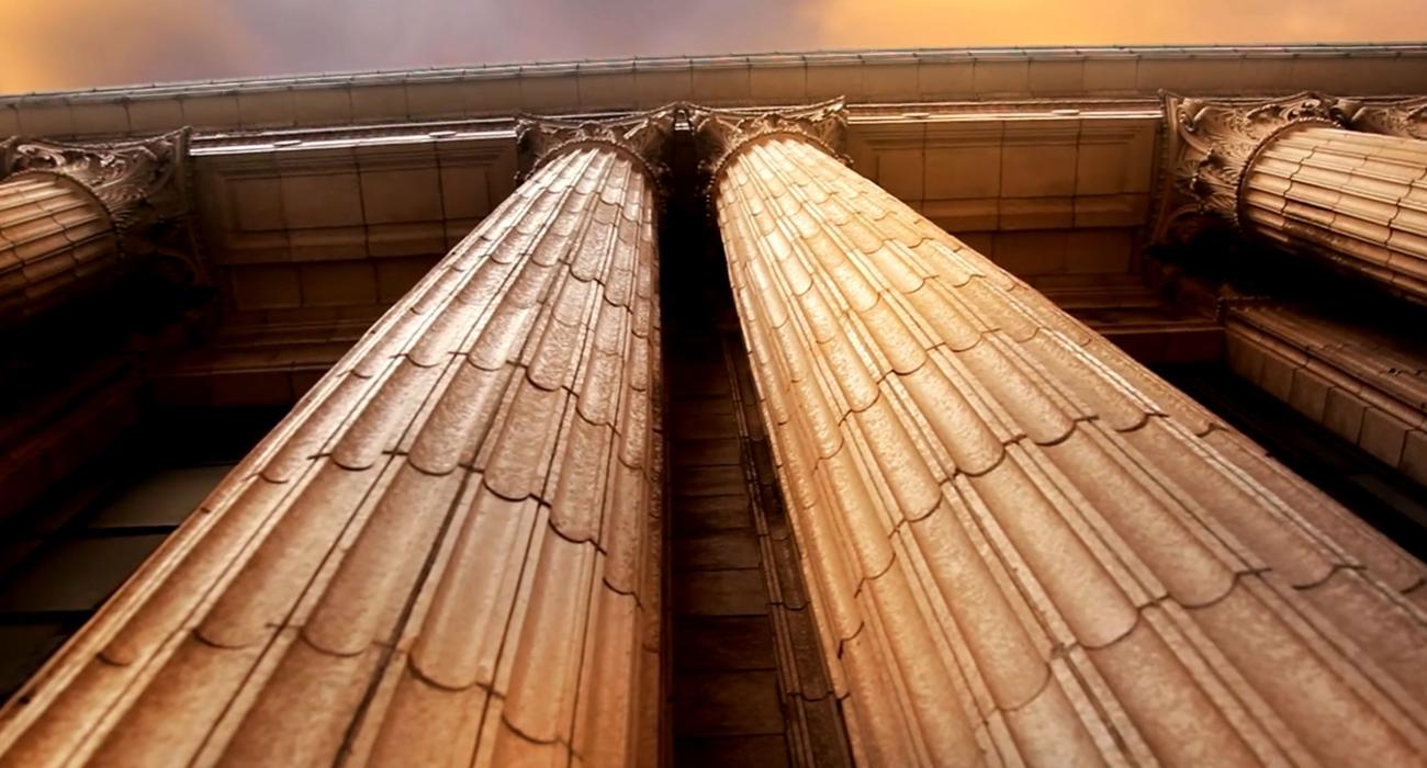 Shot of marble Corinthian columns from below.